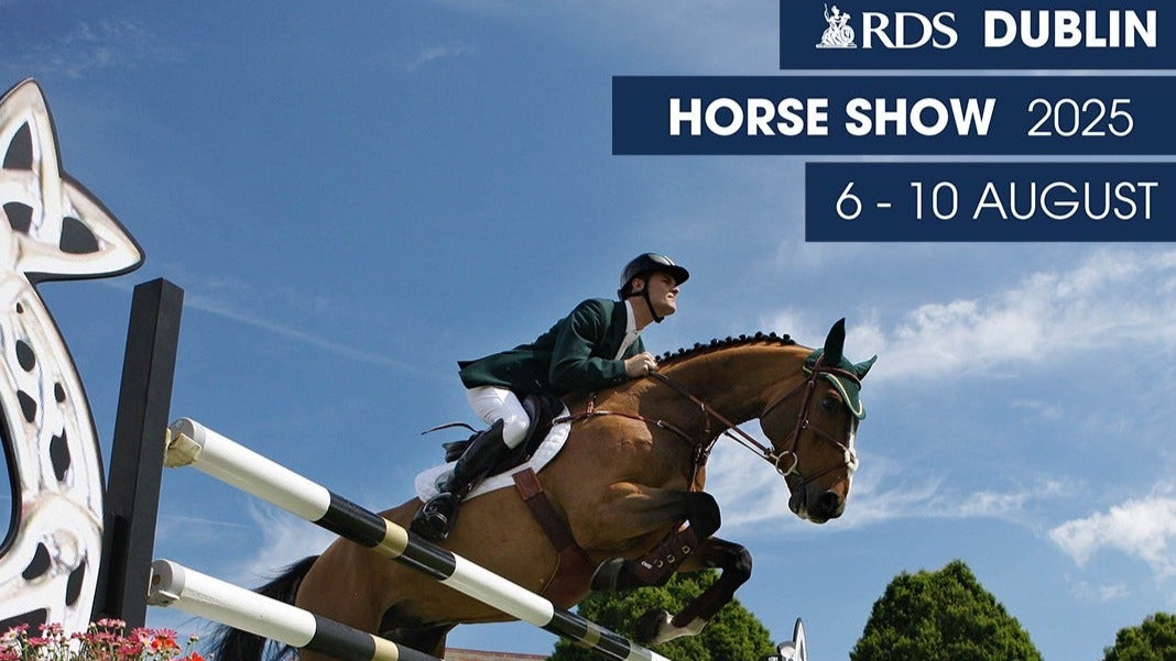 Horse and rider jumping over an obstacle at the RDS Dublin Horse Show 2025 event.