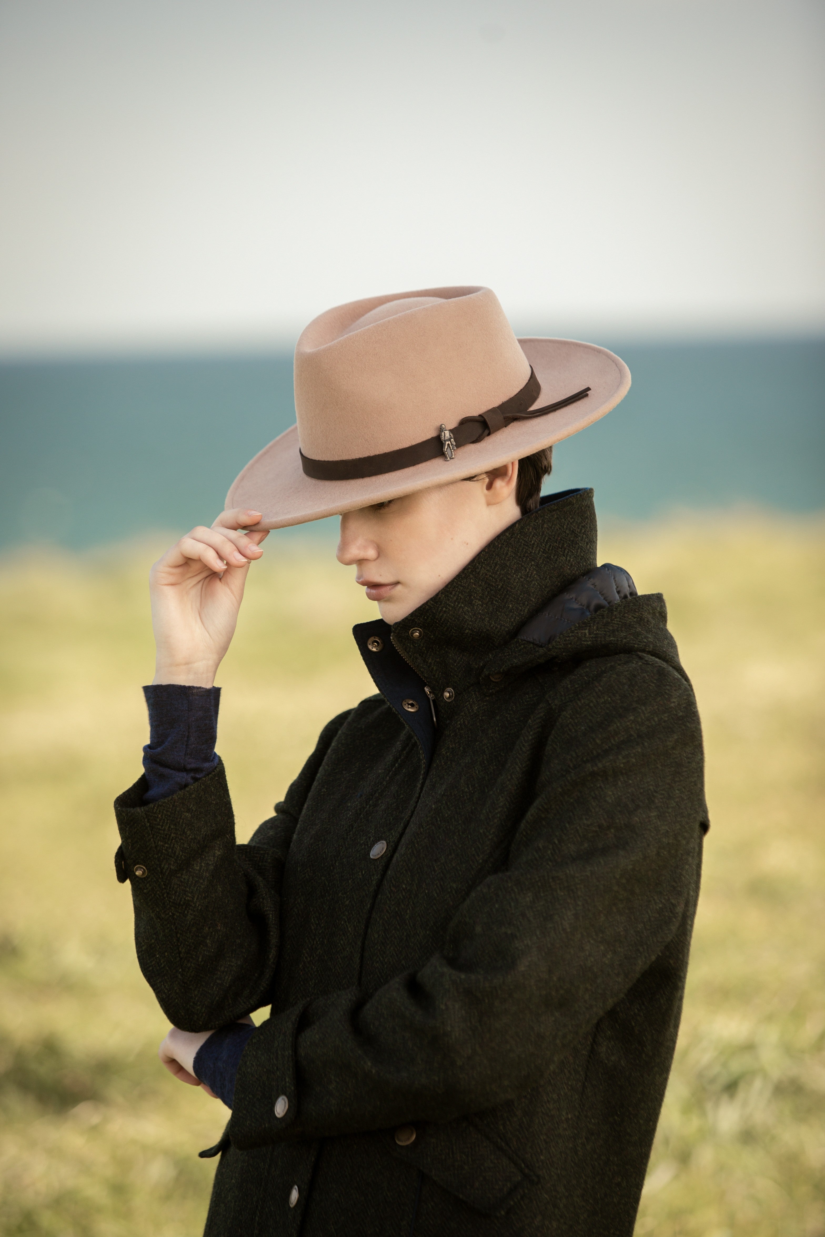 Julia tweed in green herringbone with Boston hat in Tan