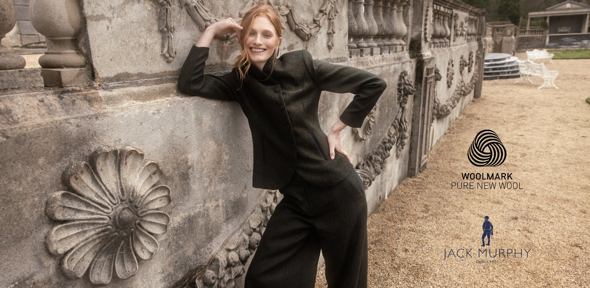 Woman in two-piece Jack Murphy Merino wool and Woolmark certified tweed jacket and culottes in green herringbone
