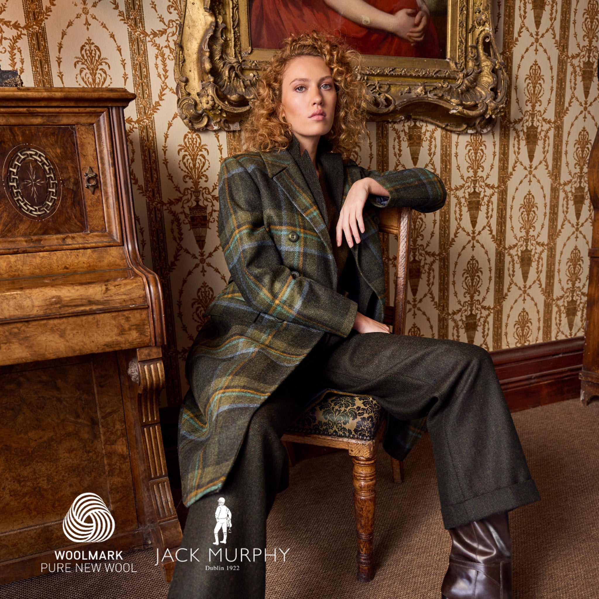 Woman wearing Woolmark-certified Jack Murphy tweed coat and tweed trousers in green herringbone and sage and emerald check.