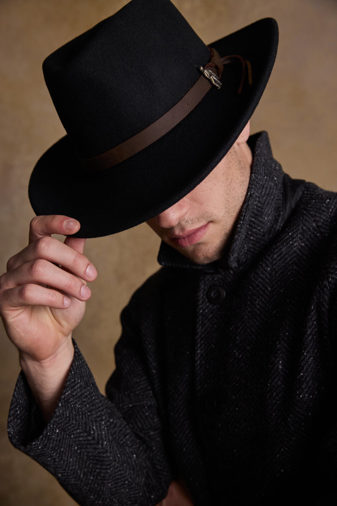 Man in a intensuive black hat